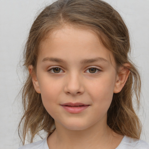 Joyful white child female with medium  brown hair and brown eyes