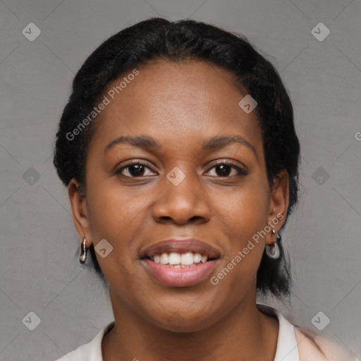 Joyful black young-adult female with short  black hair and brown eyes