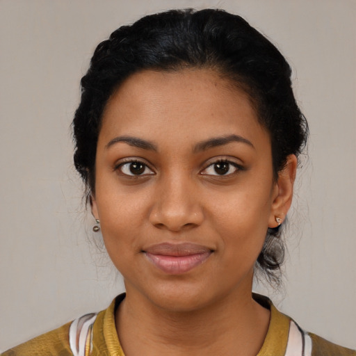 Joyful latino young-adult female with medium  black hair and brown eyes