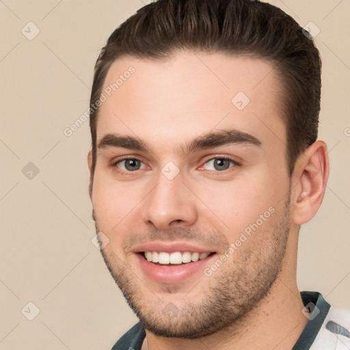 Joyful white young-adult male with short  brown hair and brown eyes