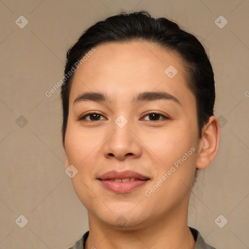 Joyful asian young-adult female with short  brown hair and brown eyes