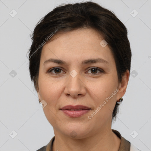 Joyful white adult female with short  brown hair and brown eyes