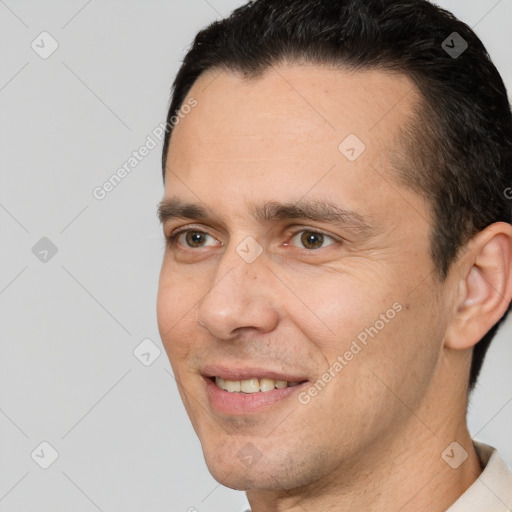 Joyful white adult male with short  brown hair and brown eyes