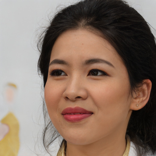 Joyful asian young-adult female with medium  brown hair and brown eyes