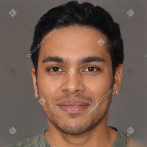 Joyful latino young-adult male with short  black hair and brown eyes