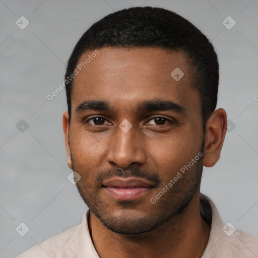 Joyful black young-adult male with short  black hair and brown eyes