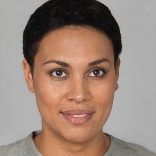Joyful latino young-adult female with short  brown hair and brown eyes