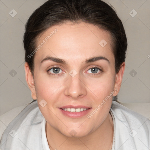 Joyful white young-adult female with short  brown hair and brown eyes