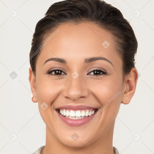 Joyful white young-adult female with short  brown hair and brown eyes