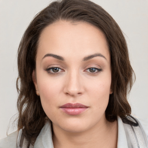 Neutral white young-adult female with medium  brown hair and brown eyes