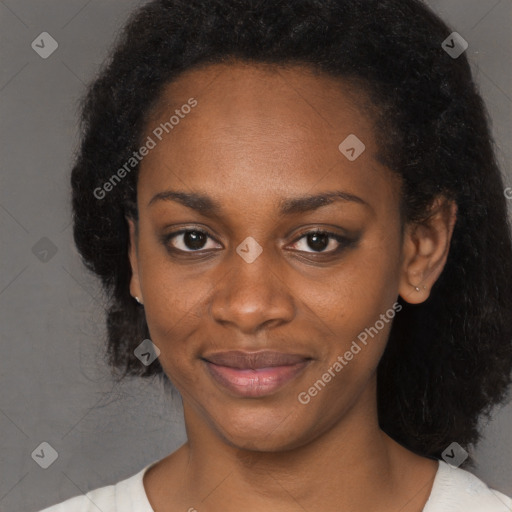 Joyful black young-adult female with medium  black hair and brown eyes