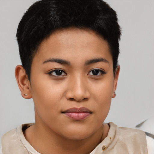 Joyful latino young-adult female with short  brown hair and brown eyes