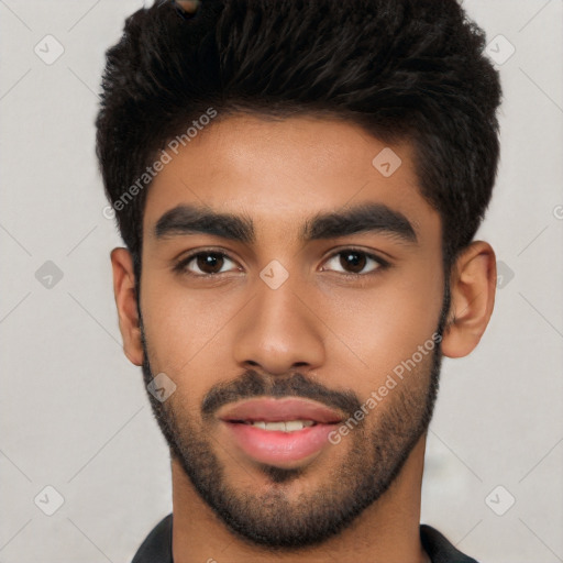 Joyful latino young-adult male with short  black hair and brown eyes