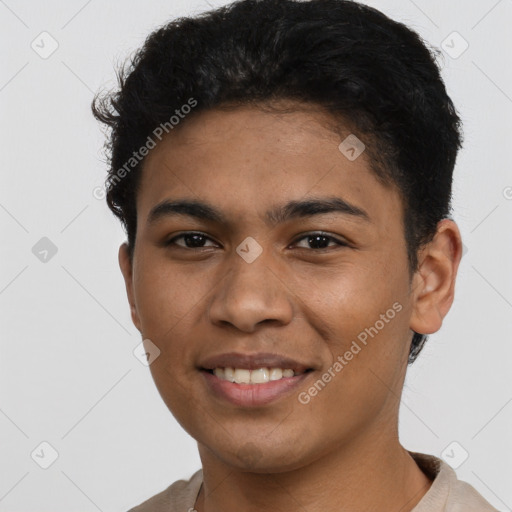 Joyful latino young-adult male with short  black hair and brown eyes