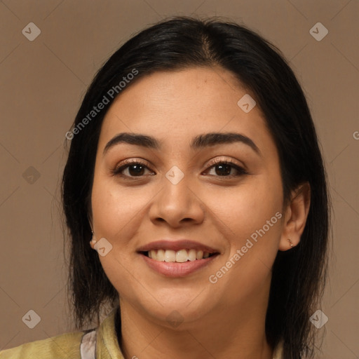 Joyful latino young-adult female with medium  brown hair and brown eyes