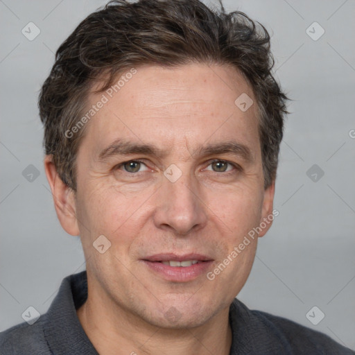 Joyful white adult male with short  brown hair and grey eyes