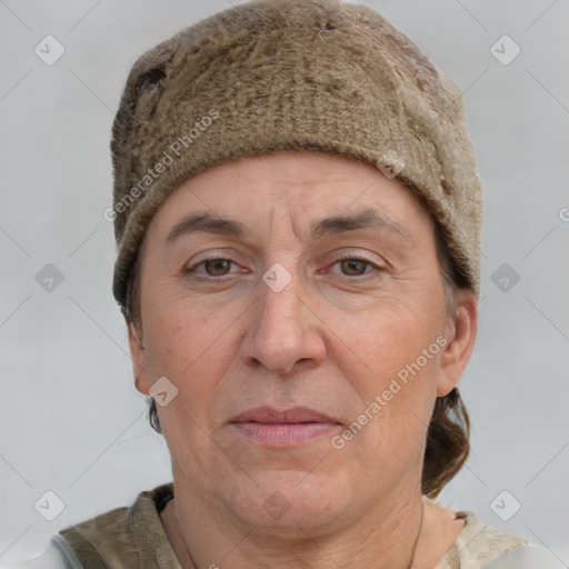 Joyful white adult female with short  brown hair and grey eyes