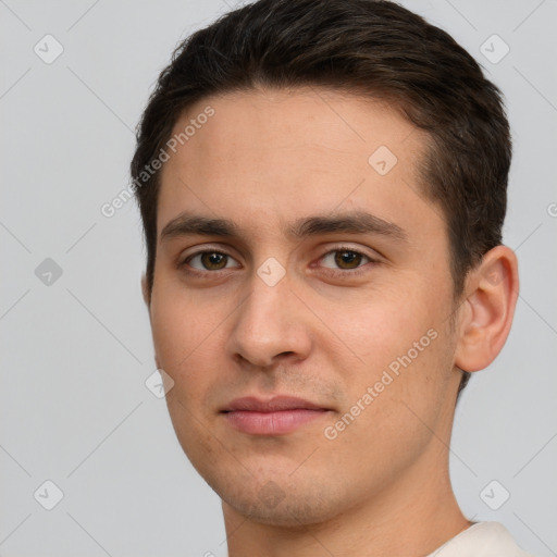 Joyful white young-adult male with short  brown hair and brown eyes