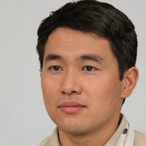 Neutral asian young-adult male with short  brown hair and brown eyes