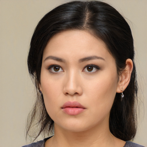 Neutral asian young-adult female with medium  black hair and brown eyes