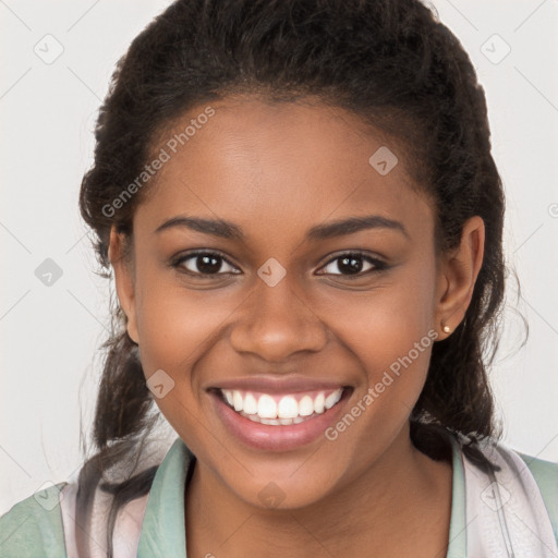 Joyful black young-adult female with long  brown hair and brown eyes