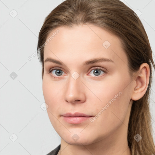 Neutral white young-adult female with long  brown hair and grey eyes