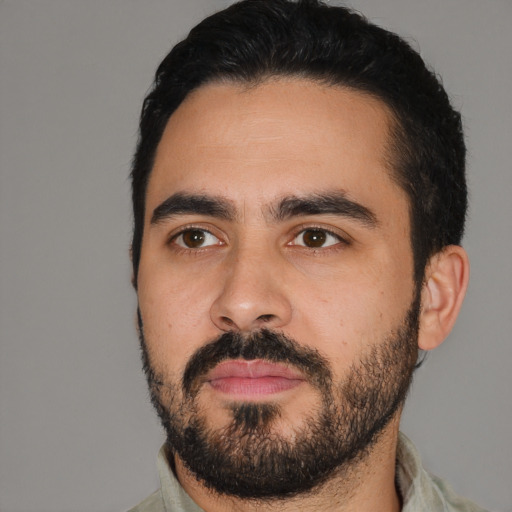 Neutral latino young-adult male with short  black hair and brown eyes