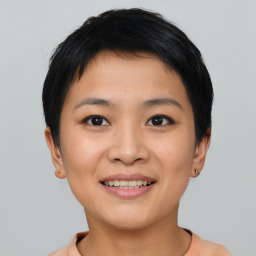 Joyful asian young-adult female with short  black hair and brown eyes