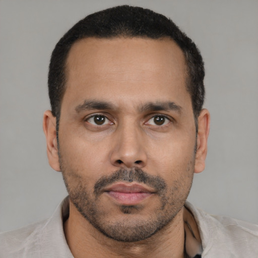 Neutral latino young-adult male with short  brown hair and brown eyes