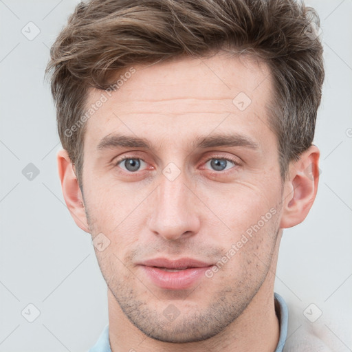 Neutral white young-adult male with short  brown hair and grey eyes