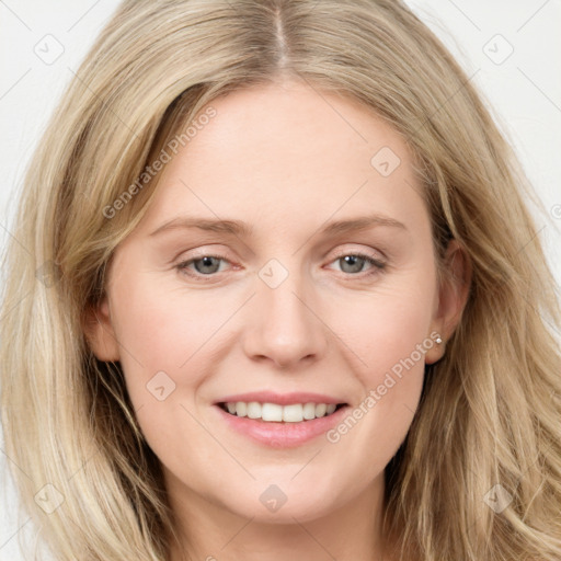 Joyful white young-adult female with long  brown hair and blue eyes