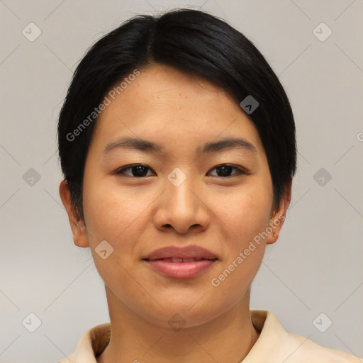 Joyful asian young-adult female with short  black hair and brown eyes