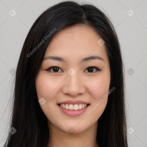 Joyful asian young-adult female with long  brown hair and brown eyes