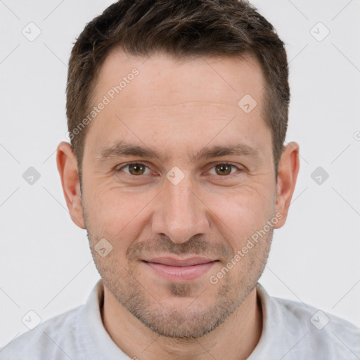 Joyful white adult male with short  brown hair and brown eyes