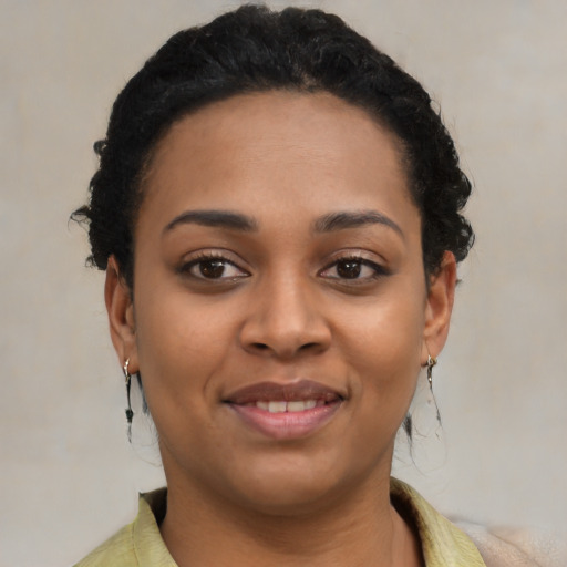Joyful latino young-adult female with short  brown hair and brown eyes