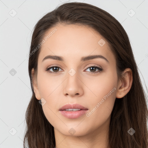 Neutral white young-adult female with long  brown hair and brown eyes