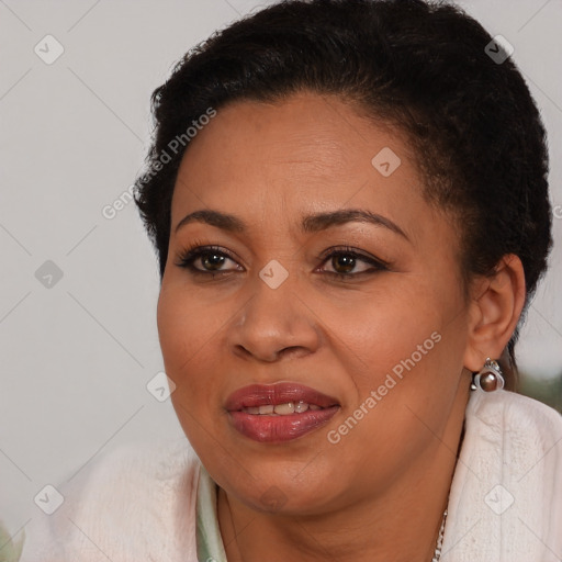 Joyful black young-adult female with short  brown hair and brown eyes