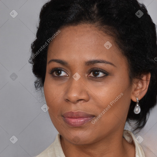 Joyful black young-adult female with medium  brown hair and brown eyes