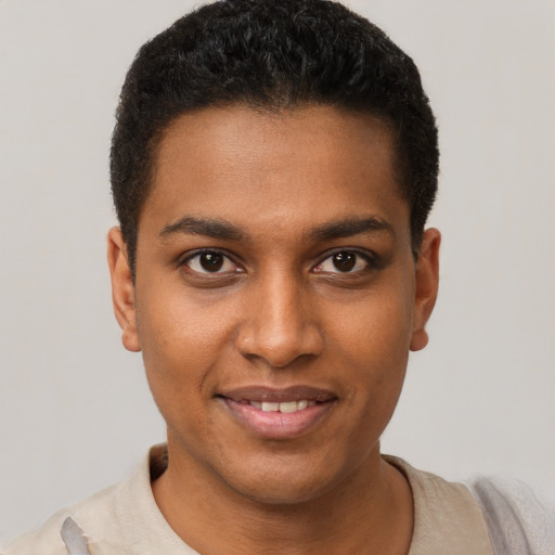 Joyful black young-adult male with short  brown hair and brown eyes