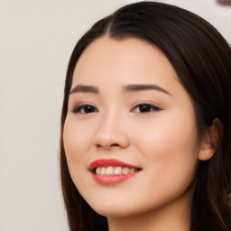 Joyful white young-adult female with long  black hair and brown eyes