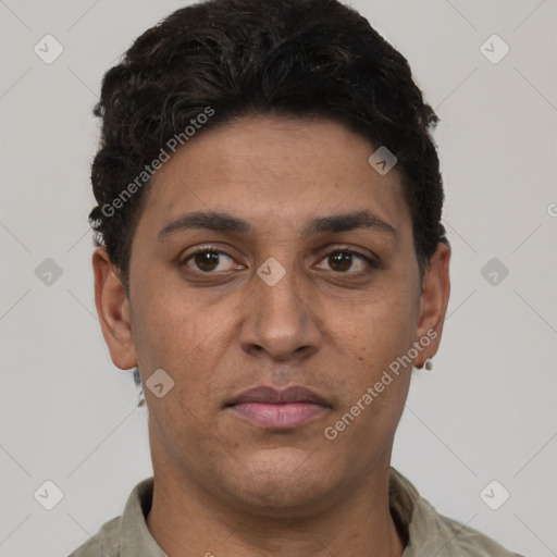 Joyful white young-adult male with short  black hair and brown eyes