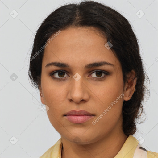 Joyful latino young-adult female with medium  brown hair and brown eyes