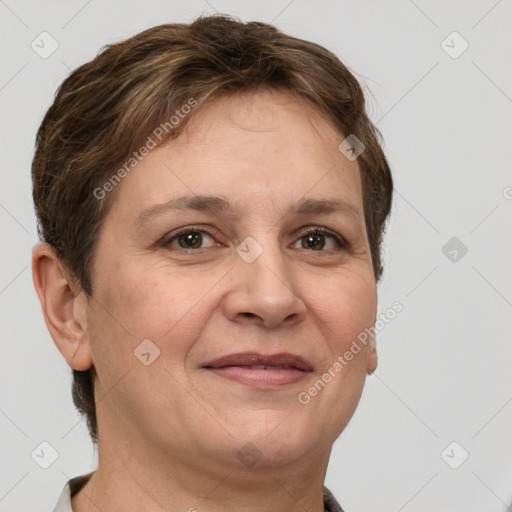 Joyful white adult female with short  brown hair and grey eyes