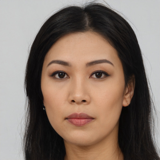 Neutral asian young-adult female with long  brown hair and brown eyes