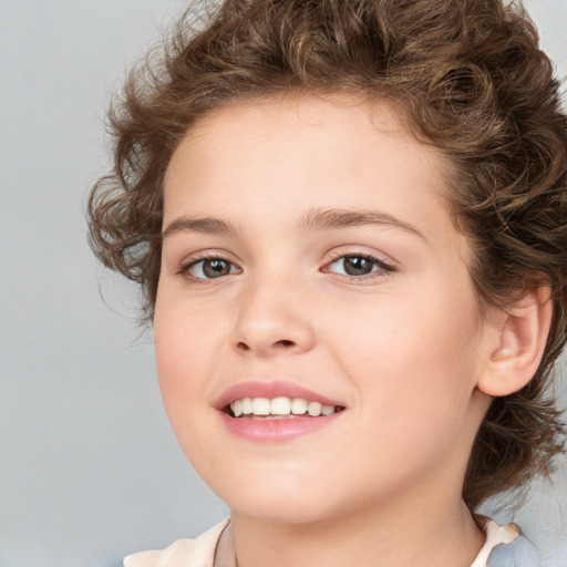 Joyful white child female with medium  brown hair and brown eyes