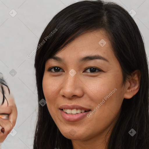 Joyful asian adult female with medium  brown hair and brown eyes