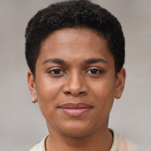 Joyful black young-adult female with short  brown hair and brown eyes