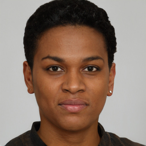 Joyful black young-adult female with short  black hair and brown eyes