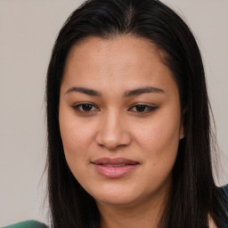 Joyful asian young-adult female with long  brown hair and brown eyes