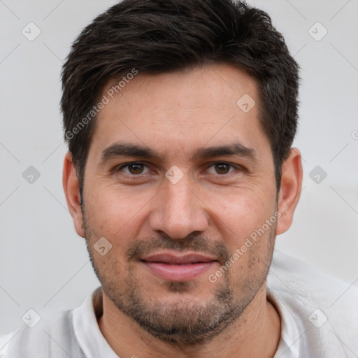 Joyful white young-adult male with short  black hair and brown eyes